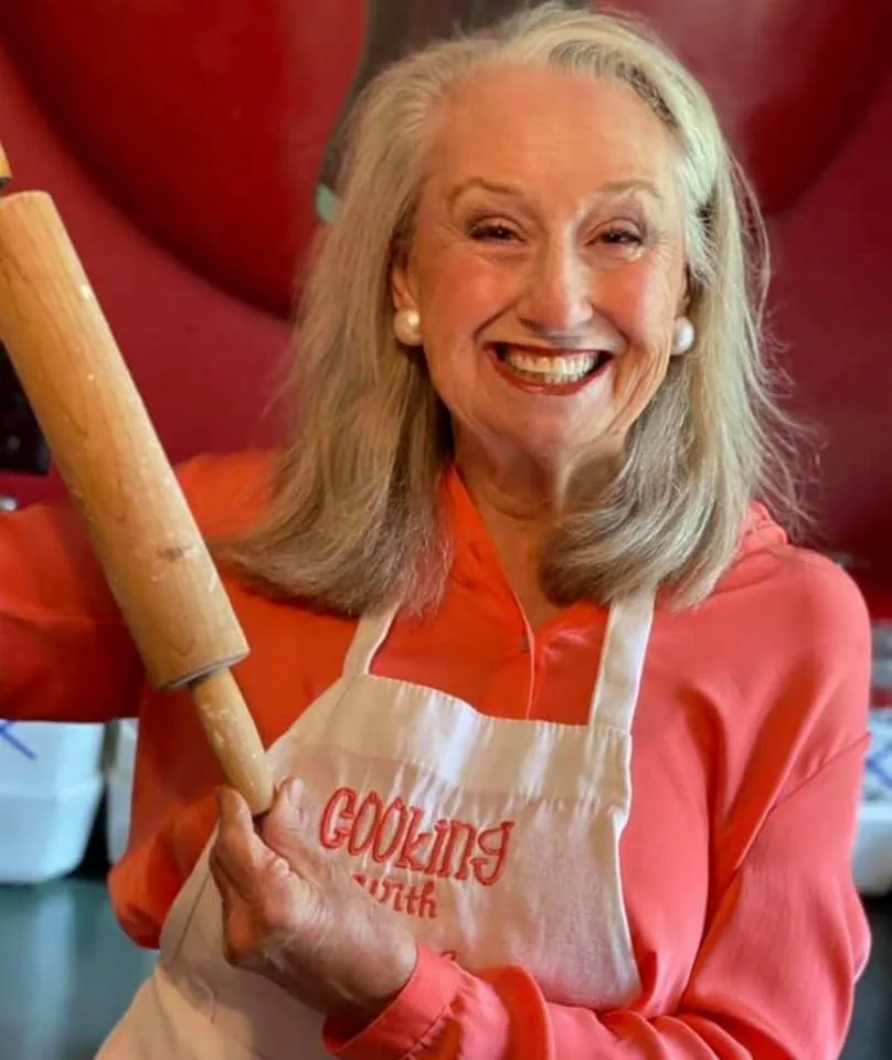Brenda Gantt holding homemade food in her kitchen